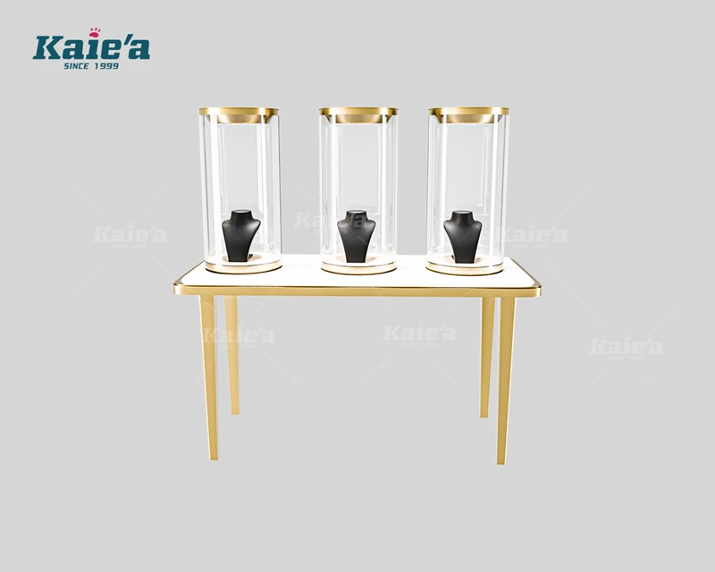 Mesa de exhibici&oacute;n de joyas de lujo con vitrinas de vidrio cil&iacute;ndricas